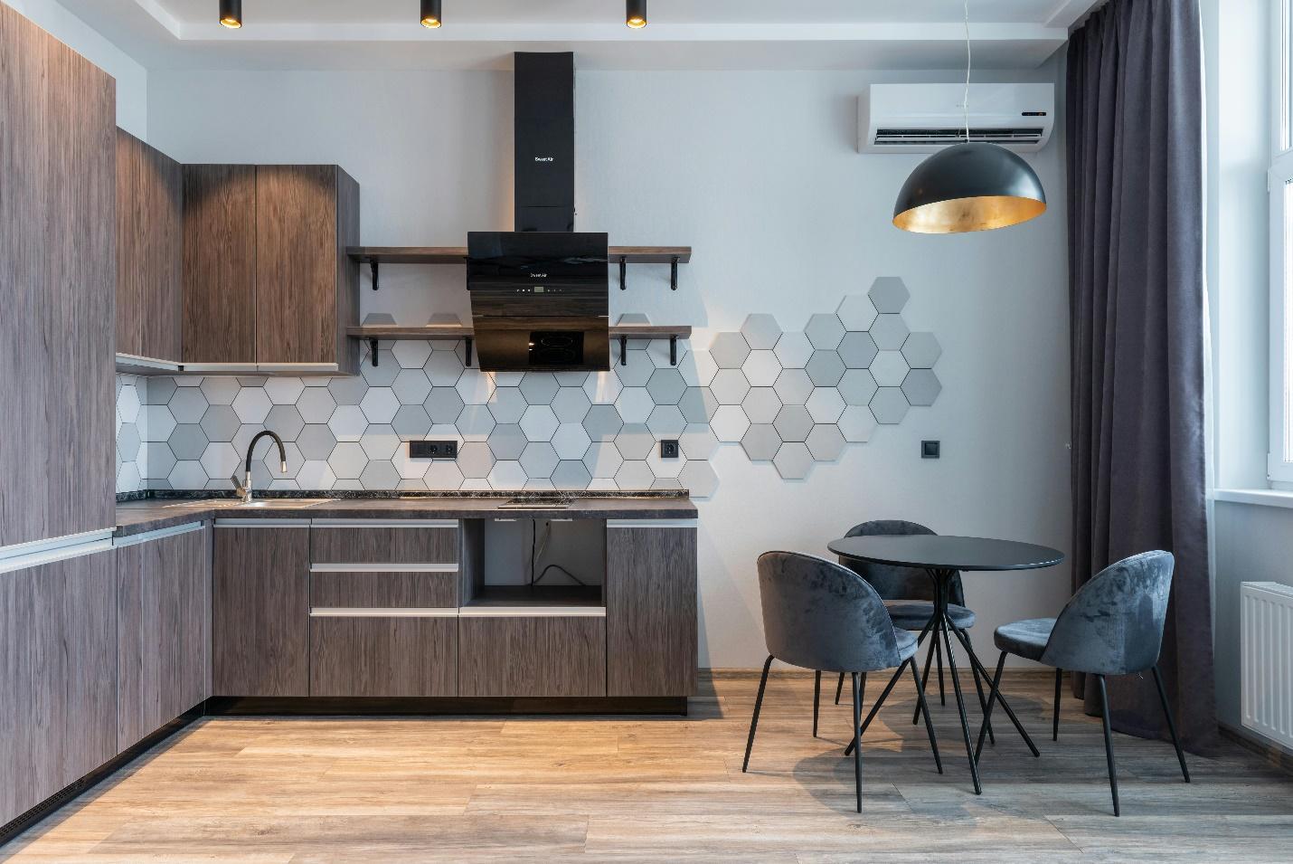 Modern kitchen interior design with a dining table and chairs.